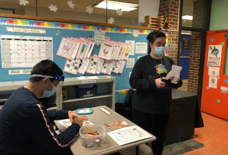  Students wearing masks in a classroom