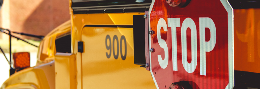Yellow School Bus With Stop Sign